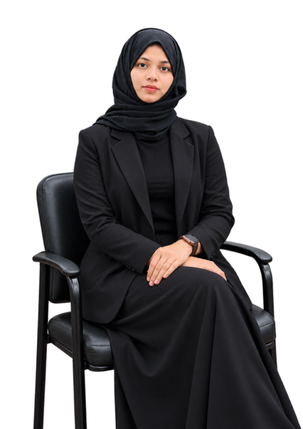 Digital marketing strategist in Kannur wearing a black professional outfit and seated on a black chair.
